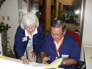 Volunteers reading notes Volunteers reading notes